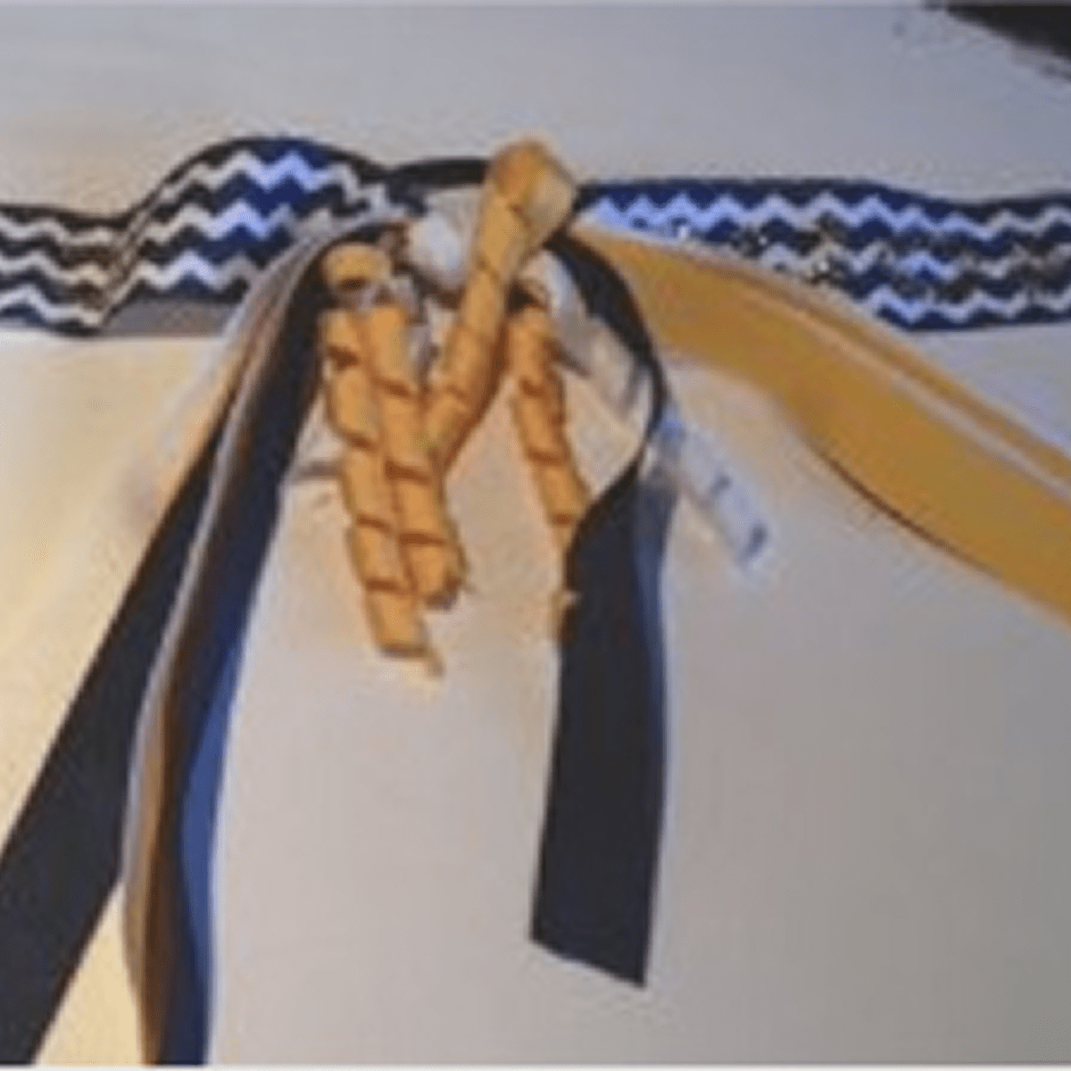 Colorful ribbons hanging from zigzag band